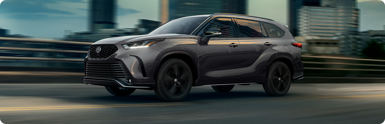 Highlander XSE driving on winding road