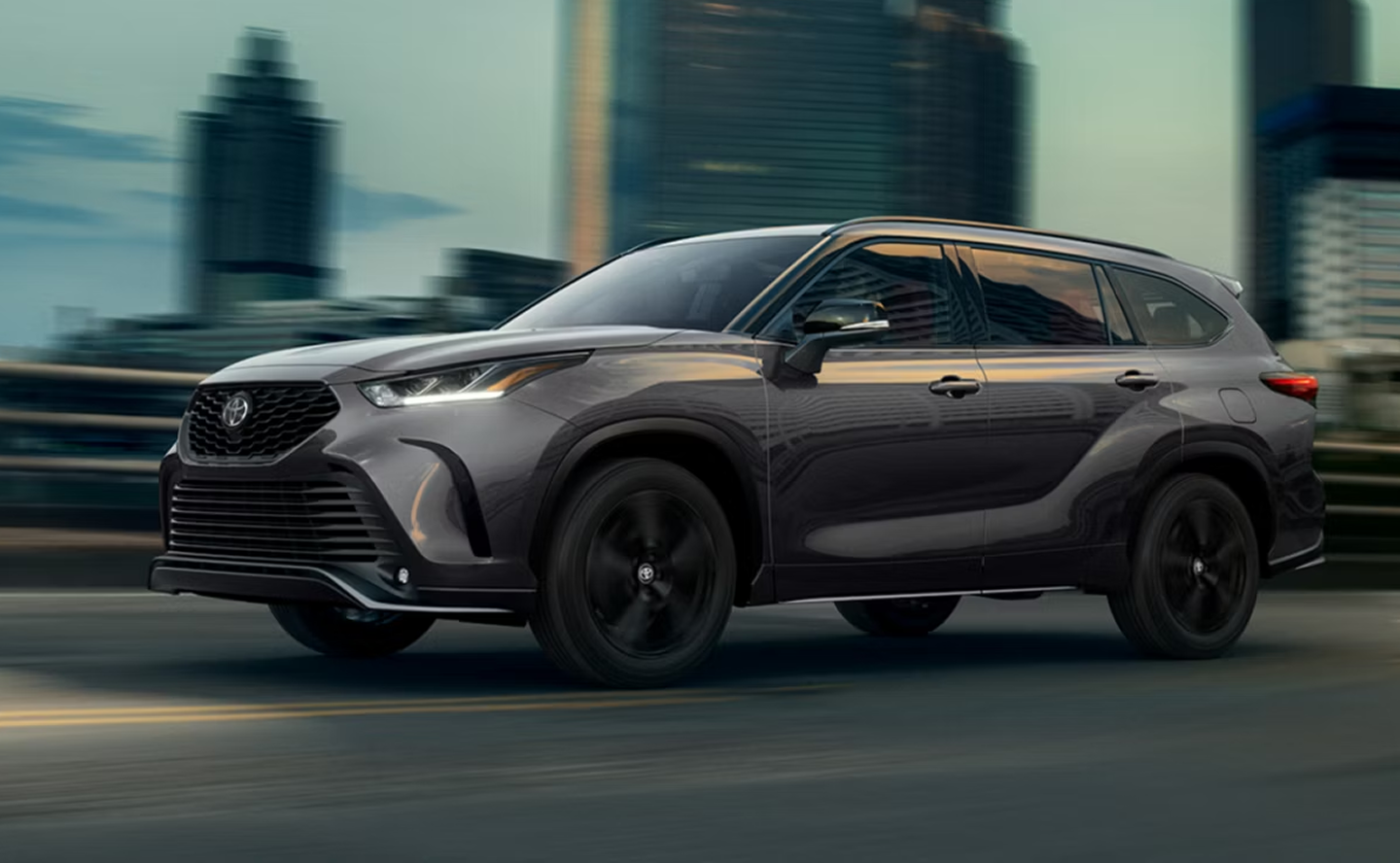 2026 Toyota Highlander - Exterior View driving through city