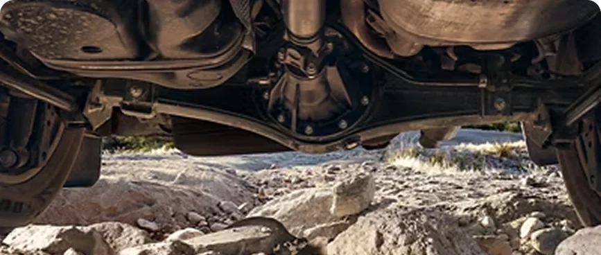 Underbody view of the Land Cruiser&rsquo;s locking differential over rocky terrain