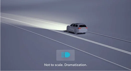 Automatic high beams illuminating a dark road