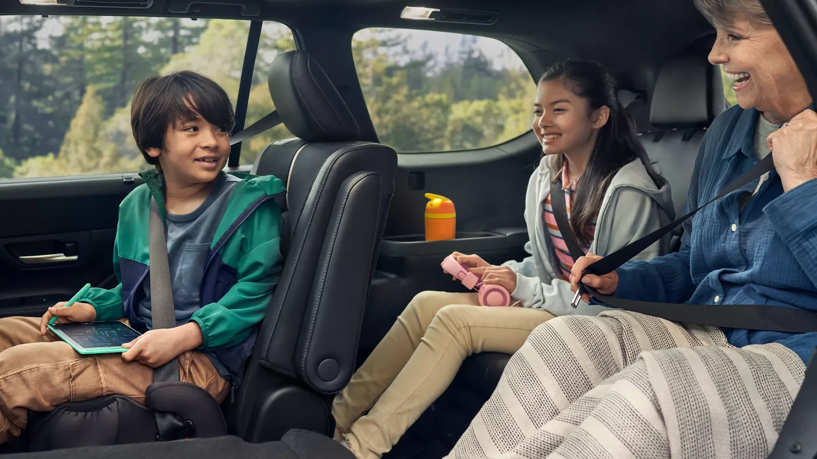 Kids and grandparent in the roomy second and third rows of a 2026 Toyota Grand Highlander — Dalton Toyota National City