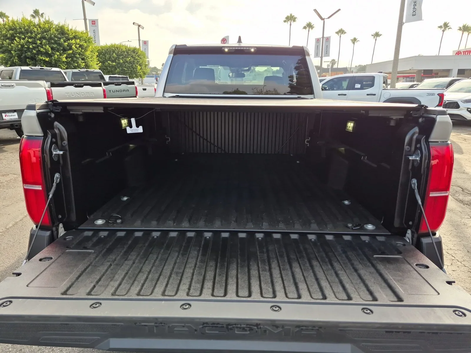 The open bed and lowered tailgate of a 2026 Toyota Tacoma
