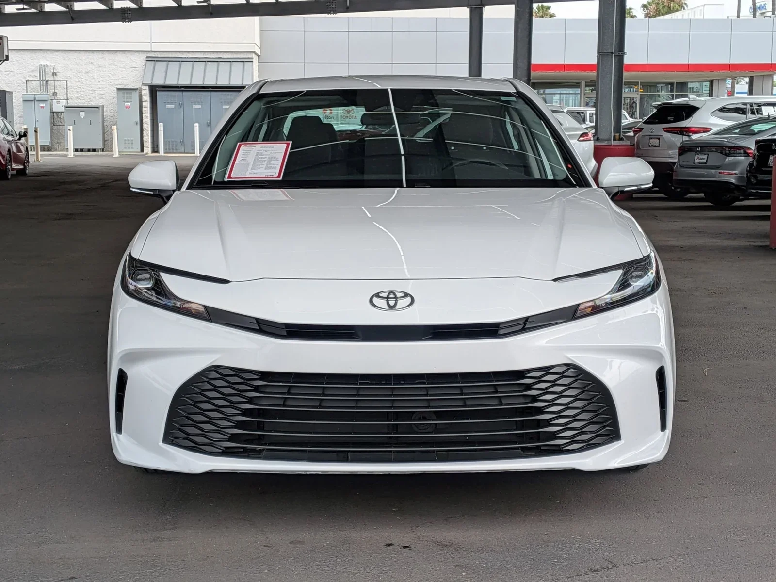 Front view of a white used Toyota Camry on the Dalton Toyota National City lot
